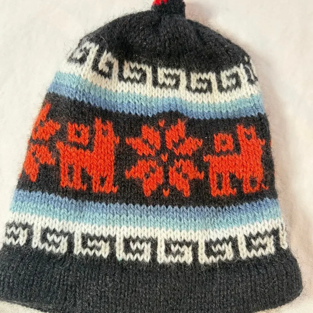 Handmade baby chullo alpaca hat from Peru. beanie, winter hat, tassels, knit cap